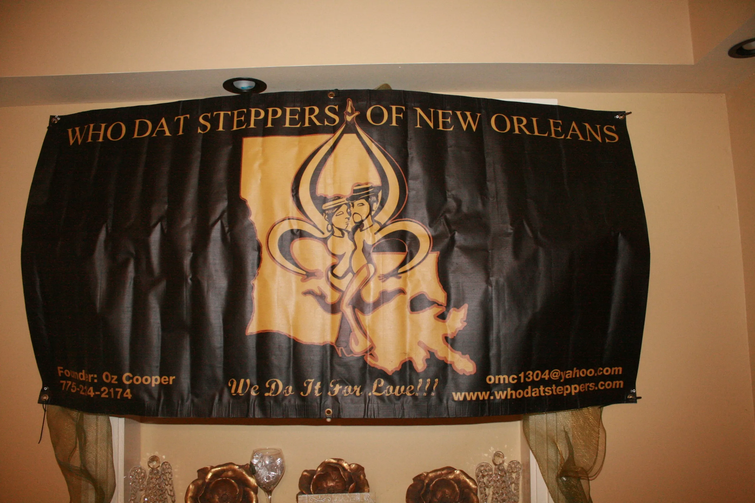 A black and gold banner with the words " dat steppers of new orleans ".